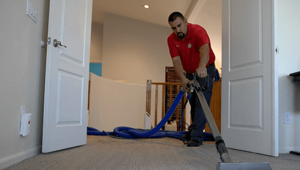 A ClearPro team member cleans this rental property's carpets as part of our Scottsdale rental property cleaning services.