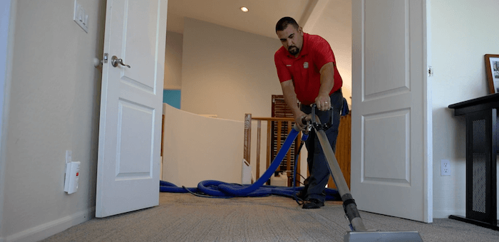 A ClearPro team member cleans this rental property's carpets as part of our Scottsdale rental property cleaning services.