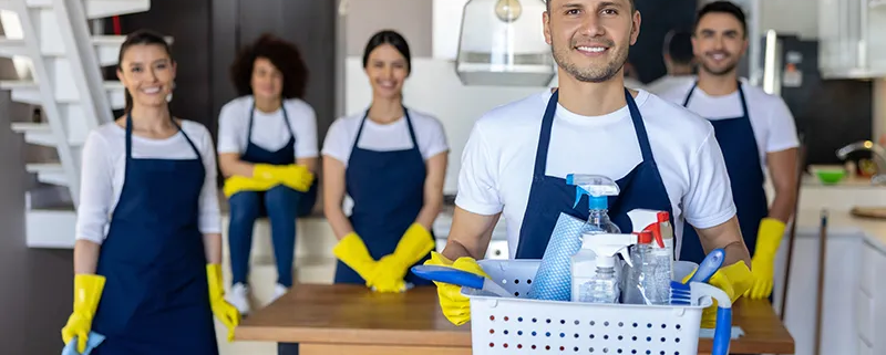 Housecleaners ready to clean a home