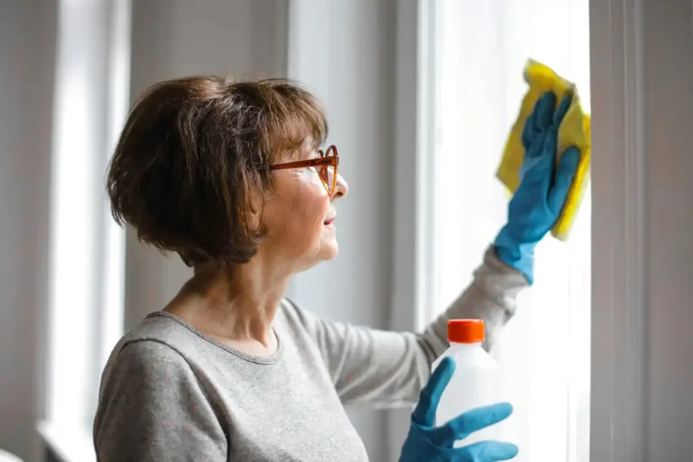 Woman Cleaning Window