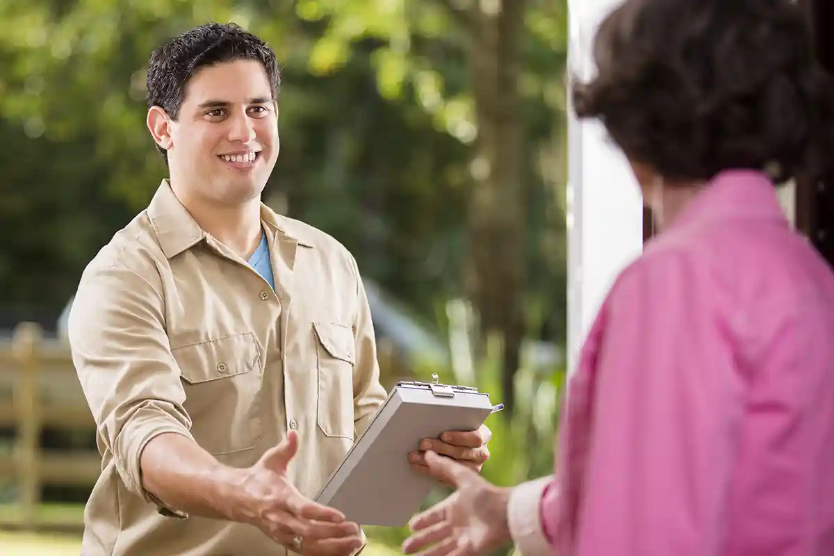 Window Cleaning Tech meets with homeowner